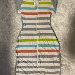 Love to Dream swaddle in Gray, Green, Orange, and White